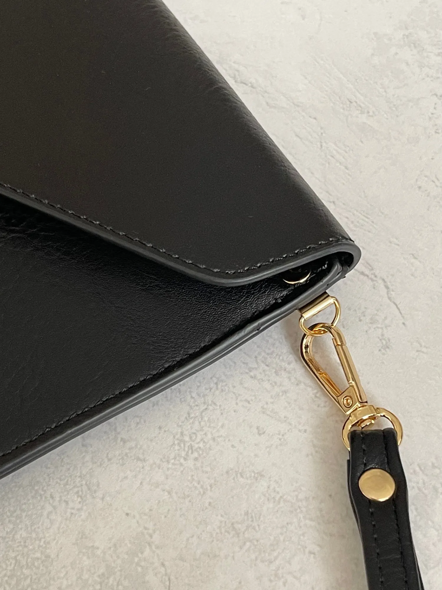 BLACK OVER-SIZED ENVELOPE CLUTCH BAG WITH LONG CROSS BODY AND WRISTLET STRAP