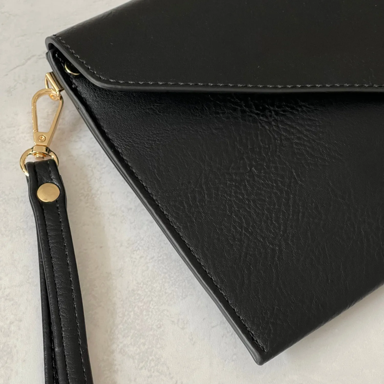 BLACK OVER-SIZED ENVELOPE CLUTCH BAG WITH LONG CROSS BODY AND WRISTLET STRAP
